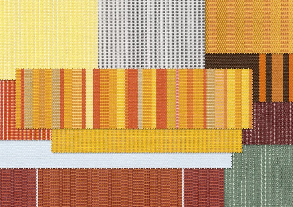 Een kleurrijke patchwork van textiel met gele, oranje en bruine tinten. Een kleurrijke patchwork van textiel met gele, oranje en bruine tinten.