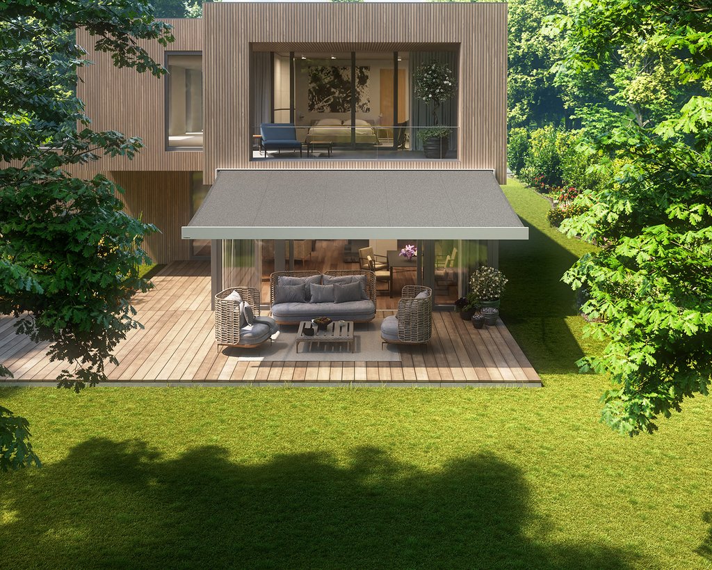 Moderne woning met een overkapping en terras in een groene tuin. Moderne woning met een overkapping en terras in een groene tuin.
