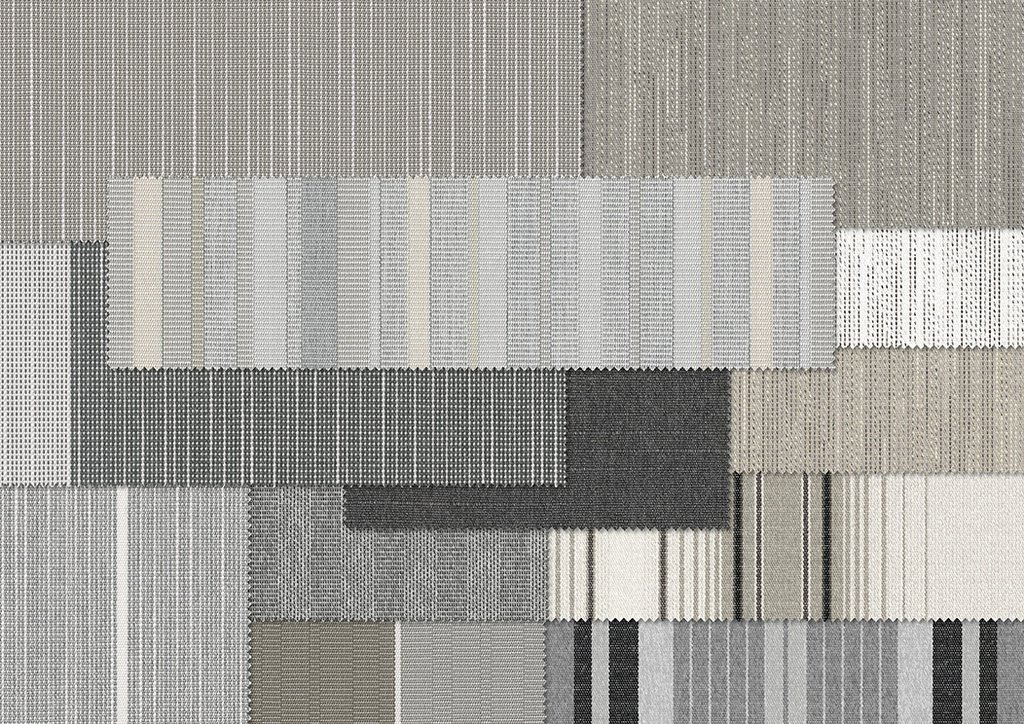 Verschillende stoffen in grijstinten met een duidelijke textuur en geometrische vormen. Verschillende stoffen in grijstinten met een duidelijke textuur en geometrische vormen.