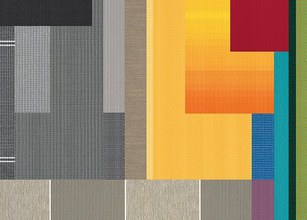 Een kleurrijk patchwork van verschillende texturen en patronen, met dominantie van geel en grijs. 