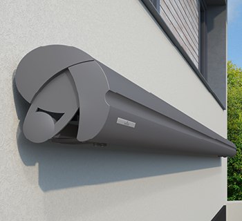 zonneschermkast in een grijze kleur, met een afgeronde en moderne vorm aan de muur bevestigd.