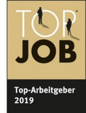 Logo met de tekst "TOP JOB" en "Top-Arbeitgeber 2019" op een zwarte achtergrond met gouden accenten.